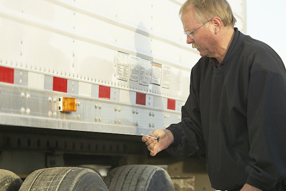 driver carrying out a truck inspection